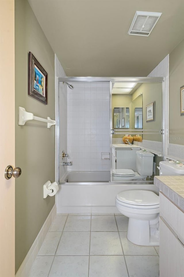 4620 Bay Blvd Unit 1148, Port Richey, FL 34668 - full bathroom with vanity, toilet, tile patterned flooring, and enclosed tub / shower combo