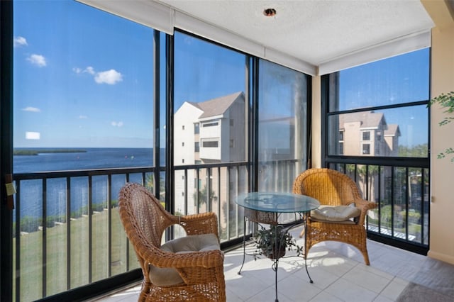 4620 Bay Blvd Unit 1148, Port Richey, FL 34668 - sunroom / solarium featuring expansive windows, tile patterned flooring, and a water view