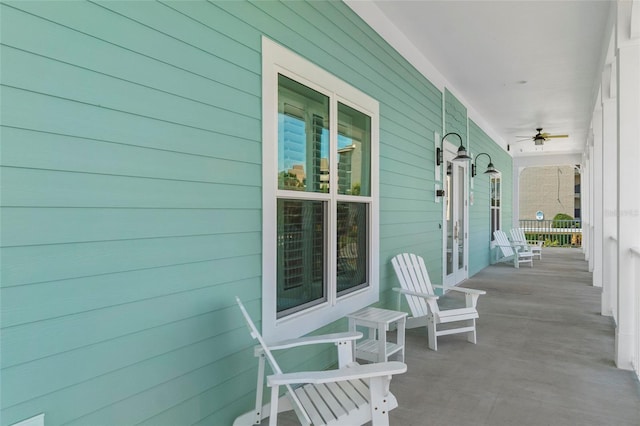 4620 Bay Blvd Unit 1148, Port Richey, FL 34668 - covered porch featuring ceiling fan and french doors