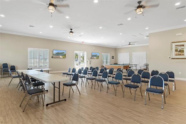 dining space with ceiling fan, light hardwood / wood-style floors, and ornamental molding