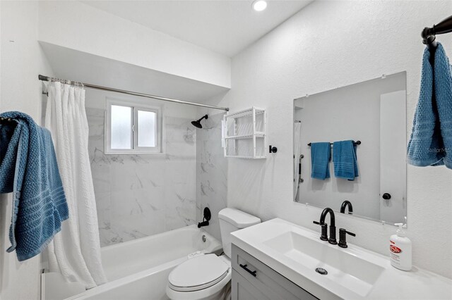 full bathroom featuring vanity, toilet, and shower / bathtub combination with curtain