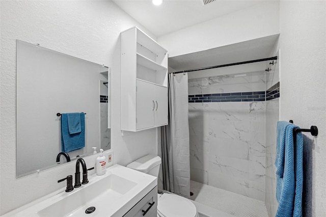 bathroom featuring toilet, vanity, and a shower with shower curtain