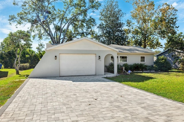 ranch-style home featuring a garage and a front yard