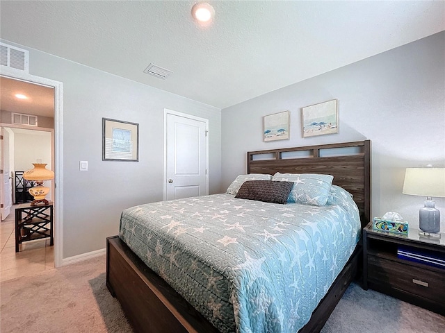 bedroom featuring light colored carpet