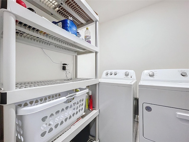 laundry area with washing machine and dryer