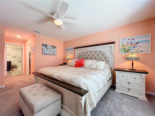 carpeted bedroom featuring a textured ceiling and ceiling fan