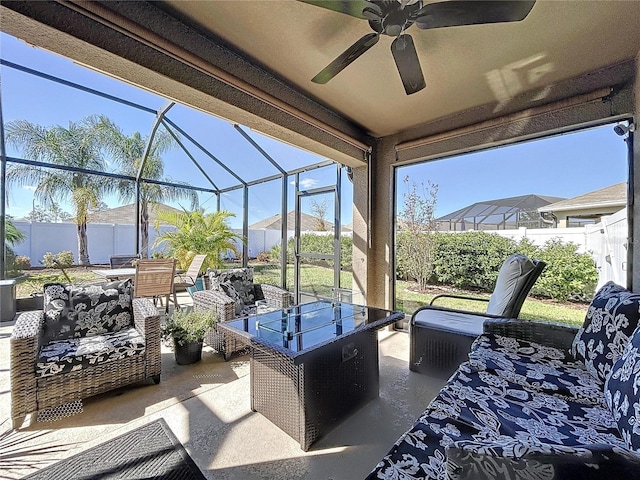 view of patio with a lanai and ceiling fan