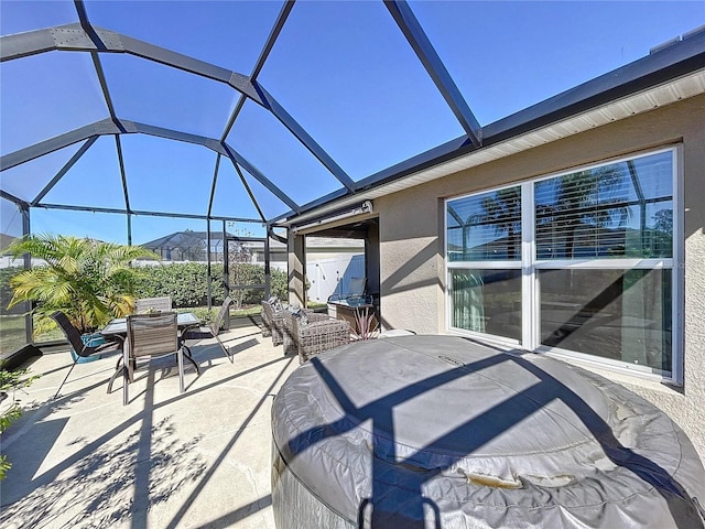 view of patio / terrace featuring glass enclosure