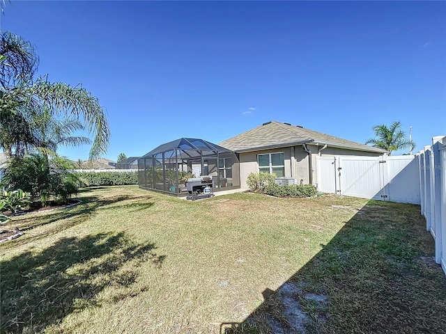 view of yard featuring a lanai