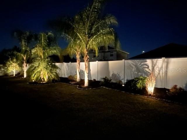 view of yard at twilight