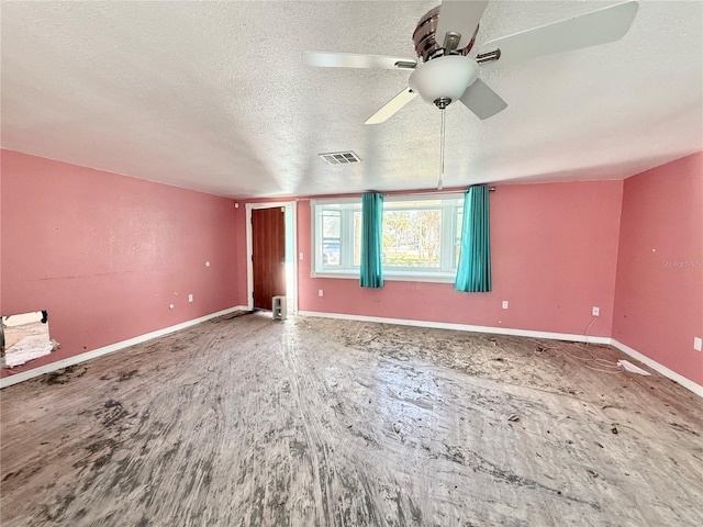 interior space with hardwood / wood-style flooring, ceiling fan, and a textured ceiling