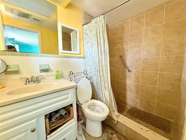 bathroom with vanity, curtained shower, toilet, and tile walls