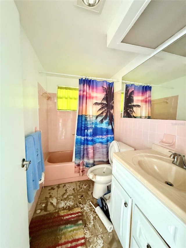 full bathroom featuring toilet, vanity, and shower / tub combo with curtain