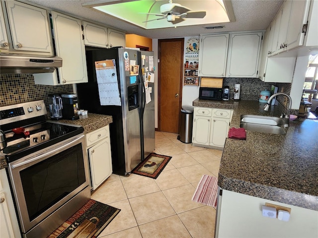 kitchen featuring sink, stainless steel appliances, light tile patterned floors, ventilation hood, and white cabinets