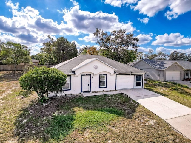 single story home featuring a garage and a front lawn