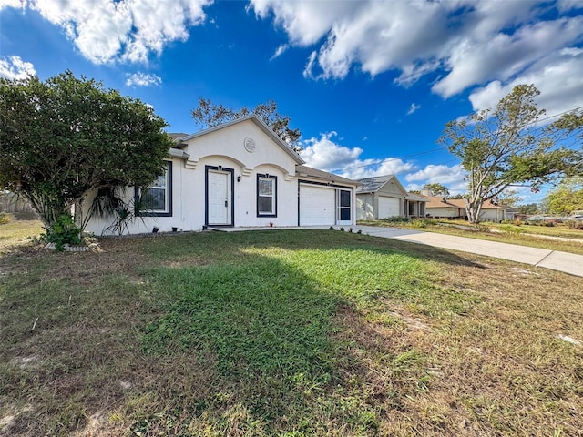 ranch-style home featuring a garage and a front lawn