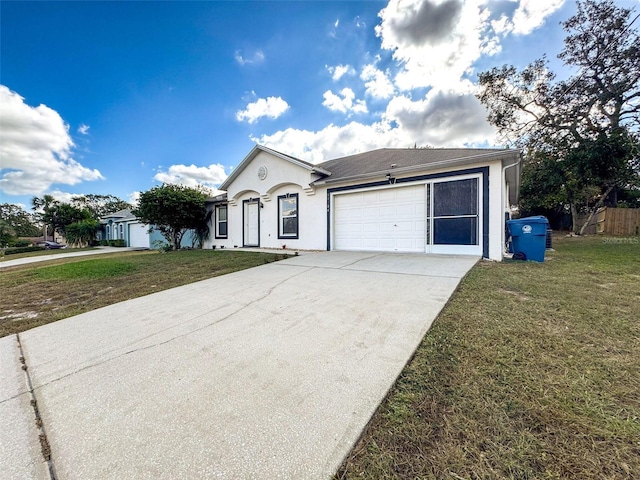 single story home featuring a front lawn and a garage