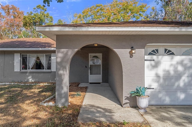 entrance to property featuring a garage