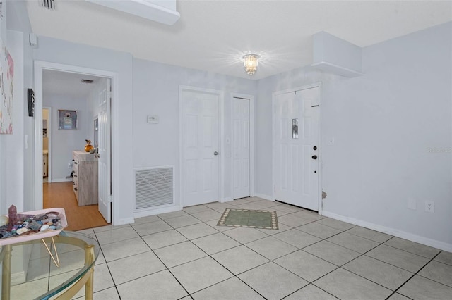 view of tiled foyer entrance