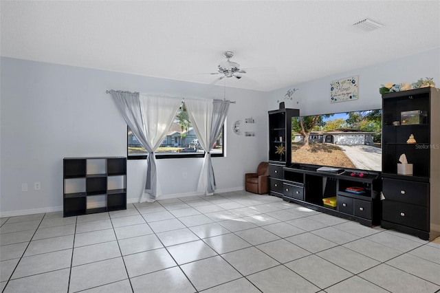 tiled living room featuring ceiling fan