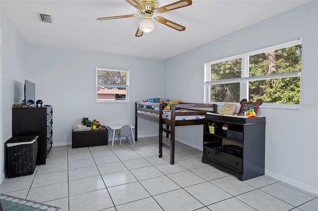 bedroom with light tile patterned floors and ceiling fan