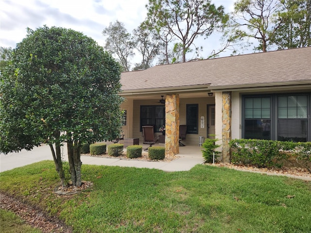 view of front of house featuring a porch and a front yard