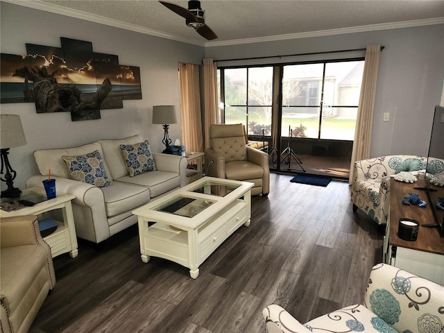 living room with a textured ceiling, ceiling fan, ornamental molding, and dark wood-type flooring