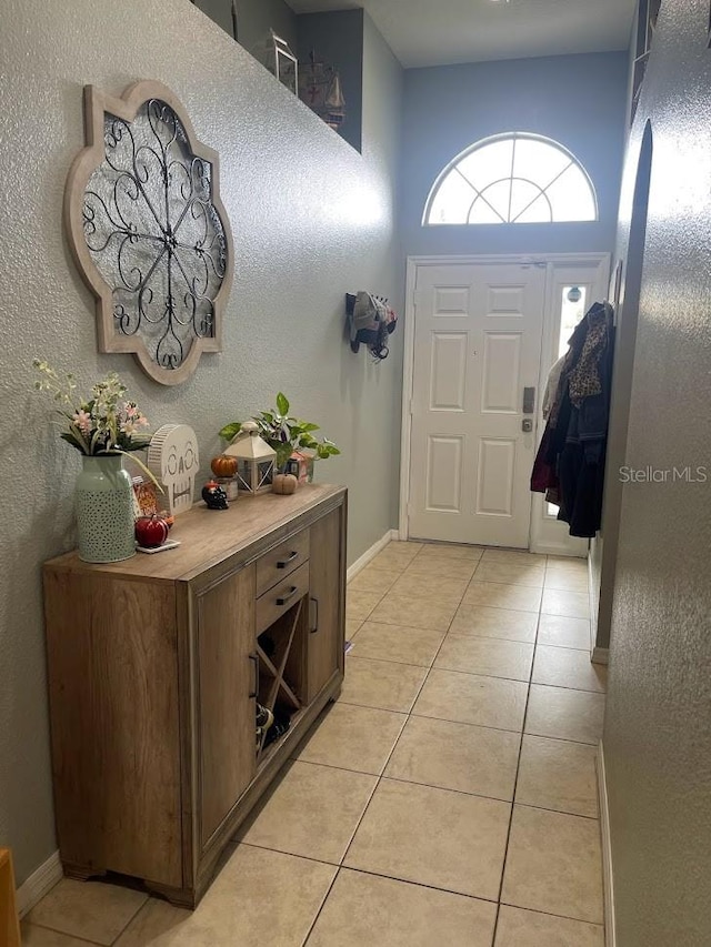 view of tiled foyer entrance