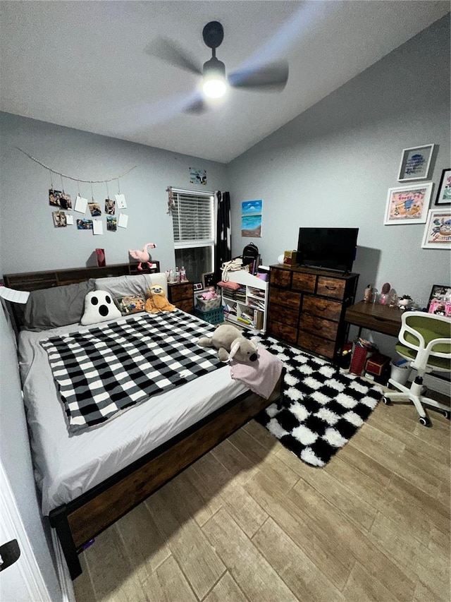 bedroom with ceiling fan and hardwood / wood-style floors