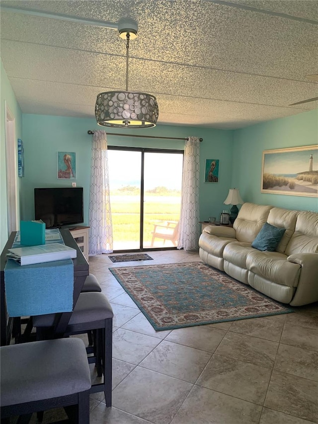 living room with tile patterned floors