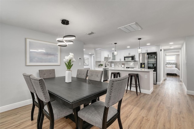 dining room featuring light wood-type flooring