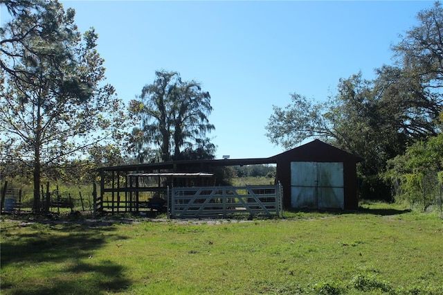 view of outbuilding featuring an outbuilding and fence