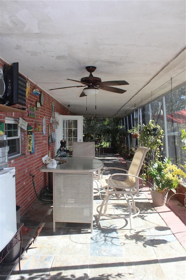 view of patio / terrace with ceiling fan and outdoor dining space