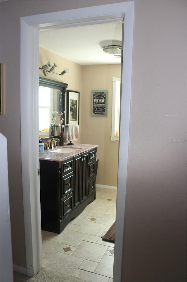 bathroom featuring vanity and baseboards