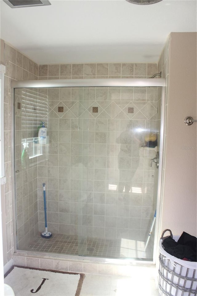 bathroom featuring a shower stall