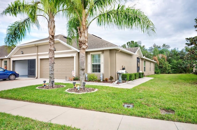 view of front of property featuring a garage and a front yard