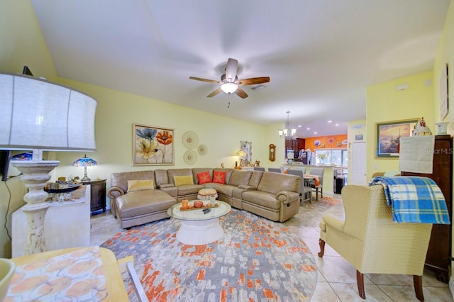 tiled living room featuring ceiling fan with notable chandelier