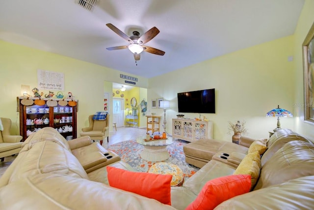 living room featuring tile patterned floors and ceiling fan