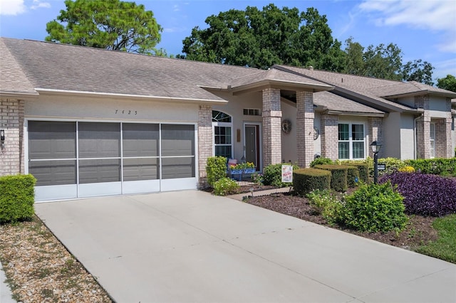 single story home with a garage