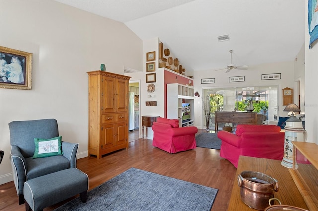 living room with ceiling fan, high vaulted ceiling, and hardwood / wood-style flooring