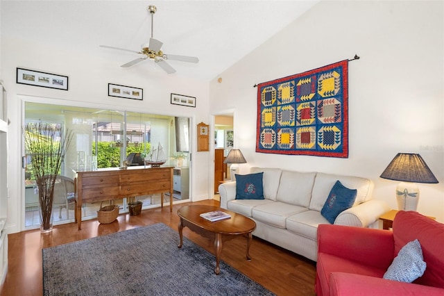 living room featuring ceiling fan, hardwood / wood-style floors, and vaulted ceiling