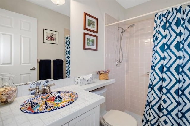 bathroom with a shower with shower curtain, vanity, and toilet