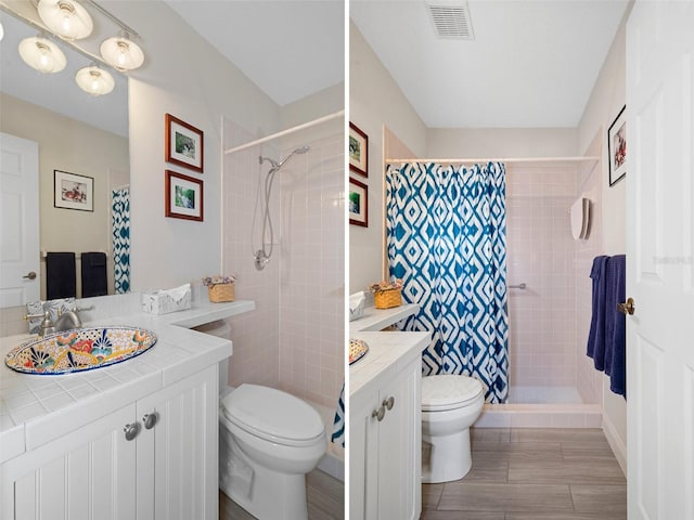 bathroom featuring vanity, toilet, and curtained shower