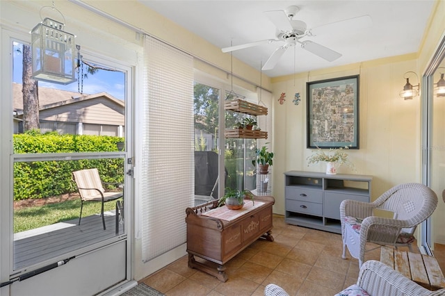 sunroom / solarium with plenty of natural light and ceiling fan