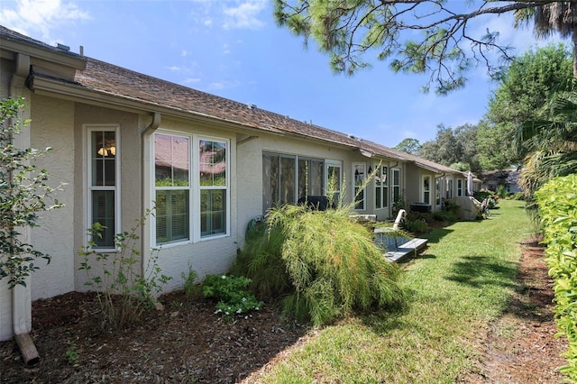 view of home's exterior featuring a lawn