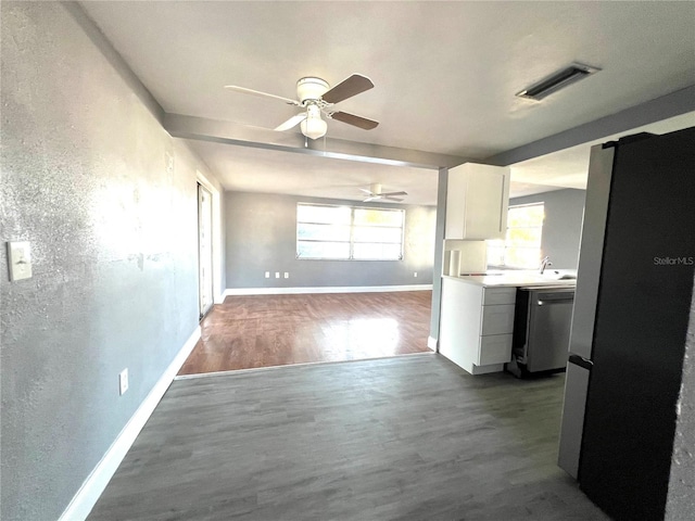 kitchen featuring ceiling fan, white cabinetry, wood-type flooring, and appliances with stainless steel finishes