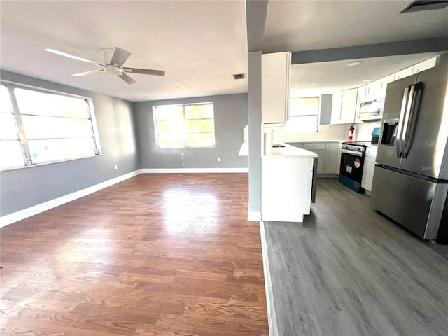 kitchen featuring dark wood-type flooring, white cabinets, sink, ceiling fan, and appliances with stainless steel finishes