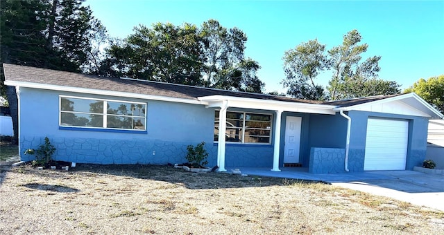 single story home featuring a garage