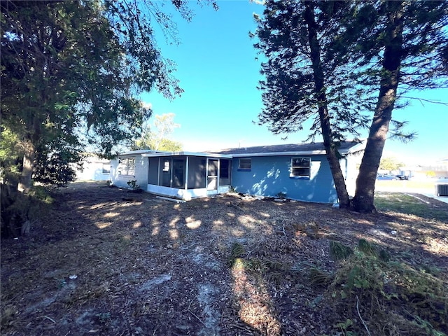 rear view of house with a sunroom