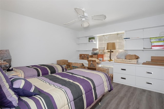 bedroom with ceiling fan and light hardwood / wood-style floors